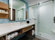 Bathroom with shower and sink