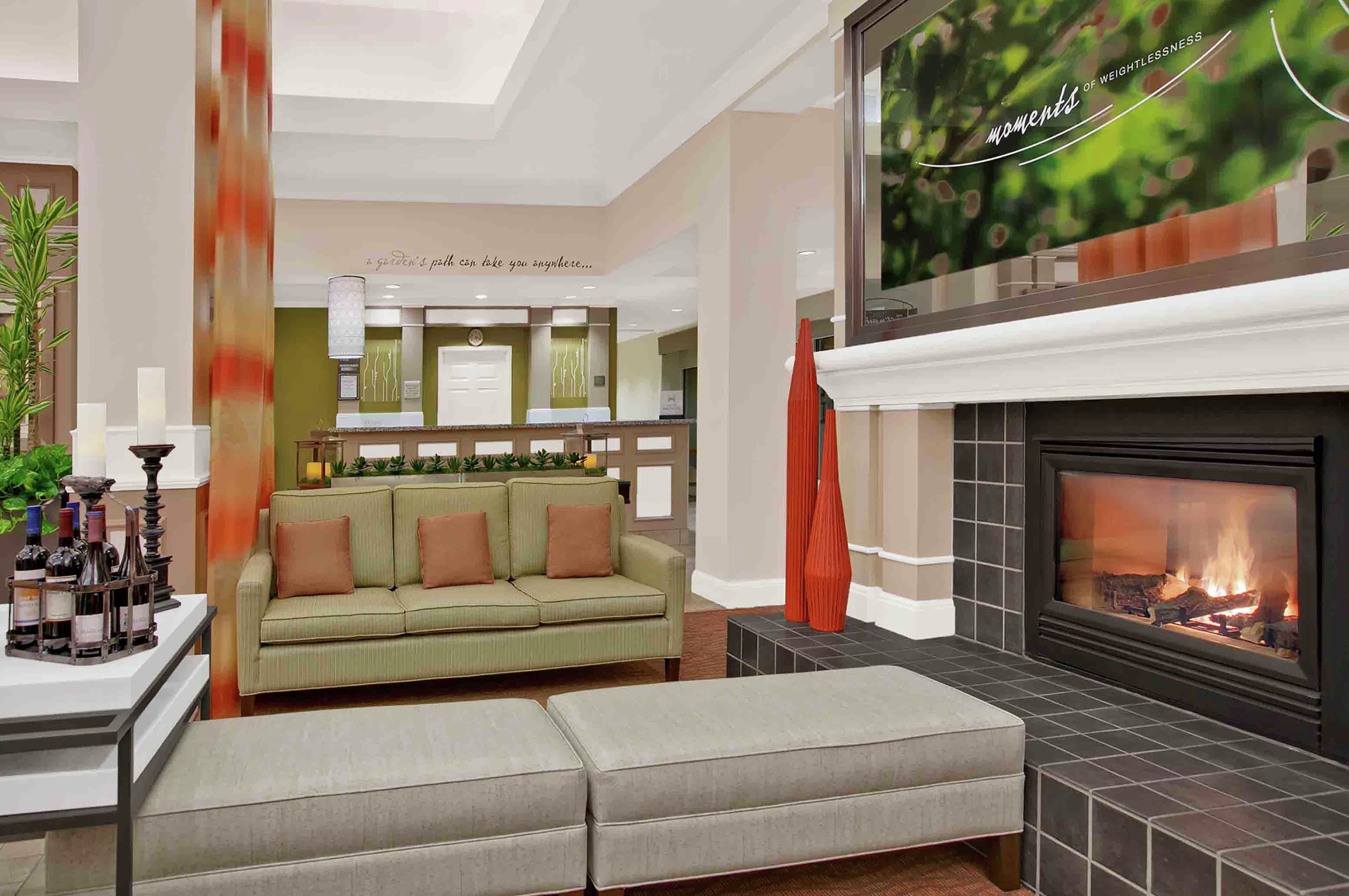 Lobby Seating Area with Sofa, Footrests and Fireplace