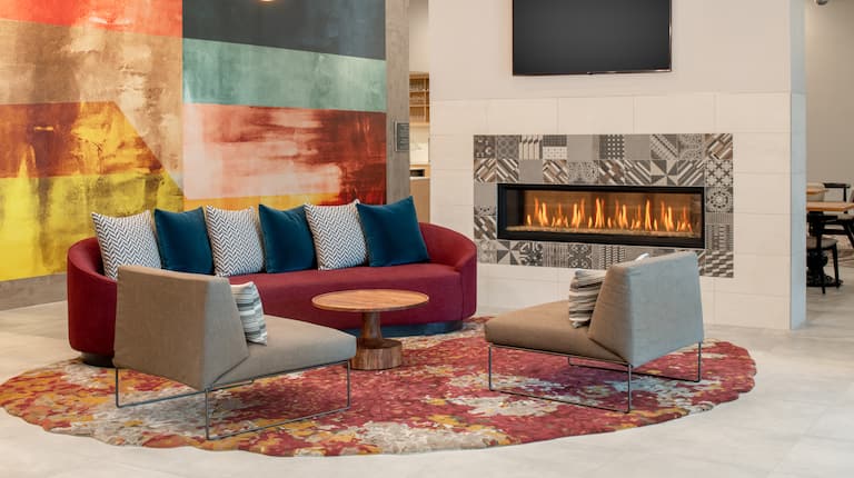 Lobby Seating Area with HDTV and Fireplace