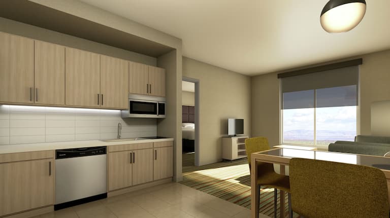 Kitchen with Dining Table and Chairs Near Living Room in King Suite