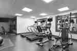 Convenient on-site fitness center for guests fully equipped with cardio machines and free weights.