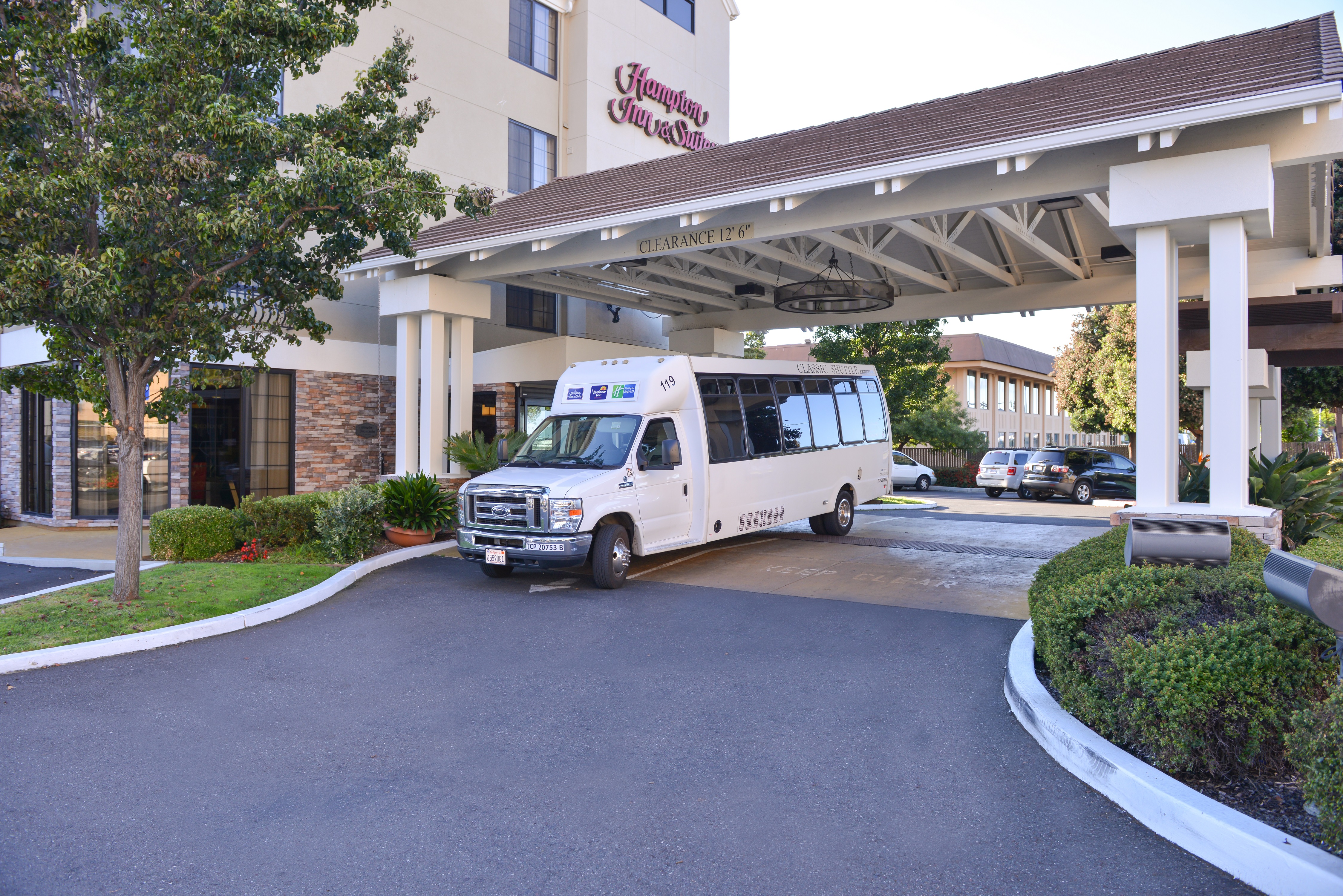 Airport Shuttle Mini-Bus at Hotel Front Entrance Area