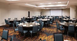 Walnut Creek Ballroom with Tables, Chairs, and Projector Screen