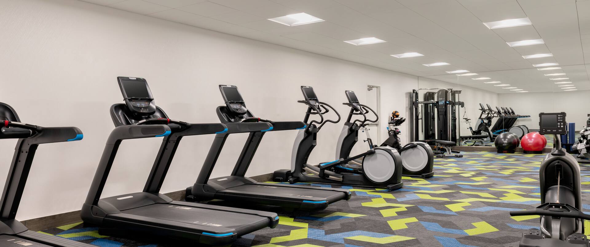 Fitness Center with Treadmills Recumbent Bikes and Exercise Balls