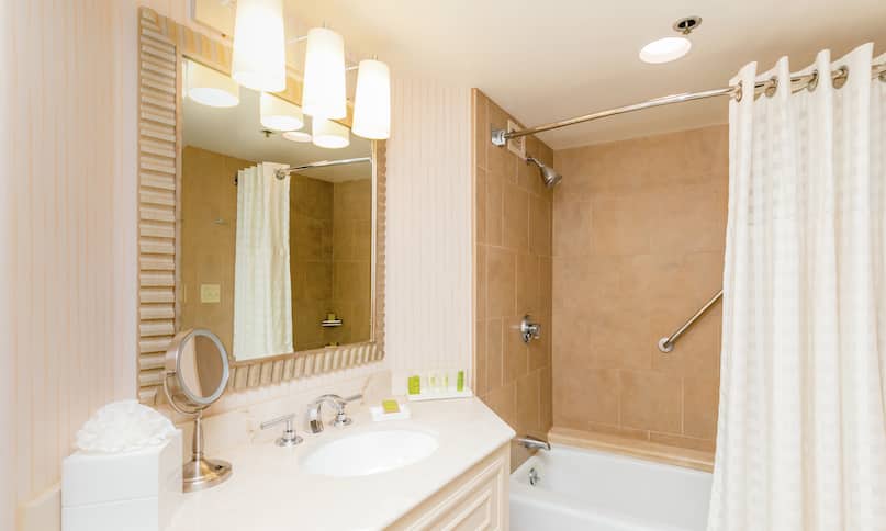 Guestroom Bathroom with Mirror, Vanity, Bathtub, and Shower-previous-transition