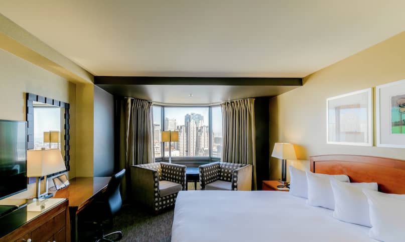 Accessible King Guestroom with Bed, Lounge Area, Outside View, Work Desk, and Room Technology