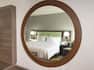 One King Bed Guest Bedroom with Armchair in Mirror Reflection