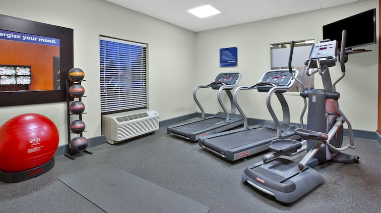 Exercise Equipment and Flat Screen TV in Fitness Center