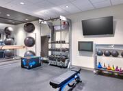 Fitness Center with Weights Exercise Balls and TV