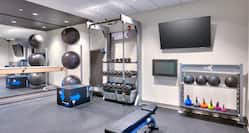 Fitness Center with Weights Exercise Balls and TV