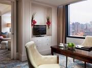 King Junior Suite work desk with flatscreen TV and city view