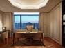 Presidential suite study with desk area and large window