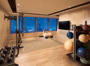 Fitness center with TV and kettlebells