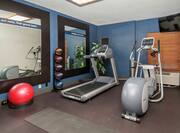 Fitness Center with Elliptical, Treadmill, Balance Ball, and Mirrors with Room Technology