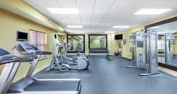 Cardio equipment and hand weights available for your workout