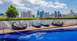 Outdoor Pool, Seating, and View of City Skyline