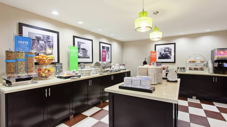 Breakfast Bar Area with Fresh Food Options and Seating 