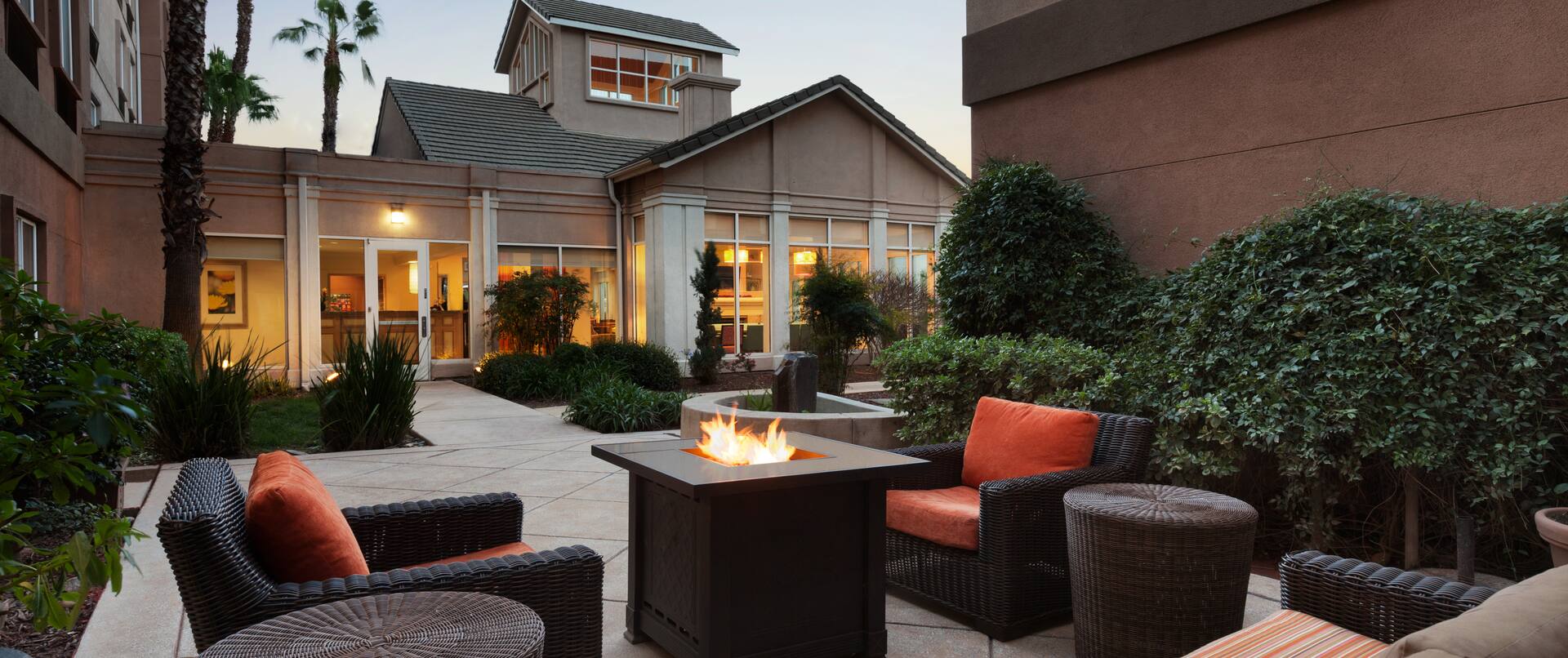 Seating Around Fire Pit on Outdoor Patio at Dusk