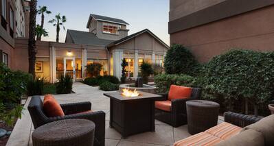Seating Around Fire Pit on Outdoor Patio at Dusk