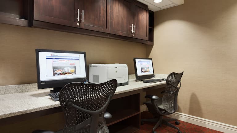Business Center With Overhead Cabinets, Two Computer Workstations, Ergonomic Chairs, and Printer