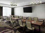 Long Tables with Chairs in Meeting Room