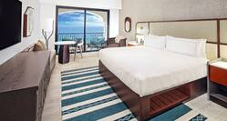 Large Bed in Guest Room with HDTV Large Bed and Ocean View from Balcony