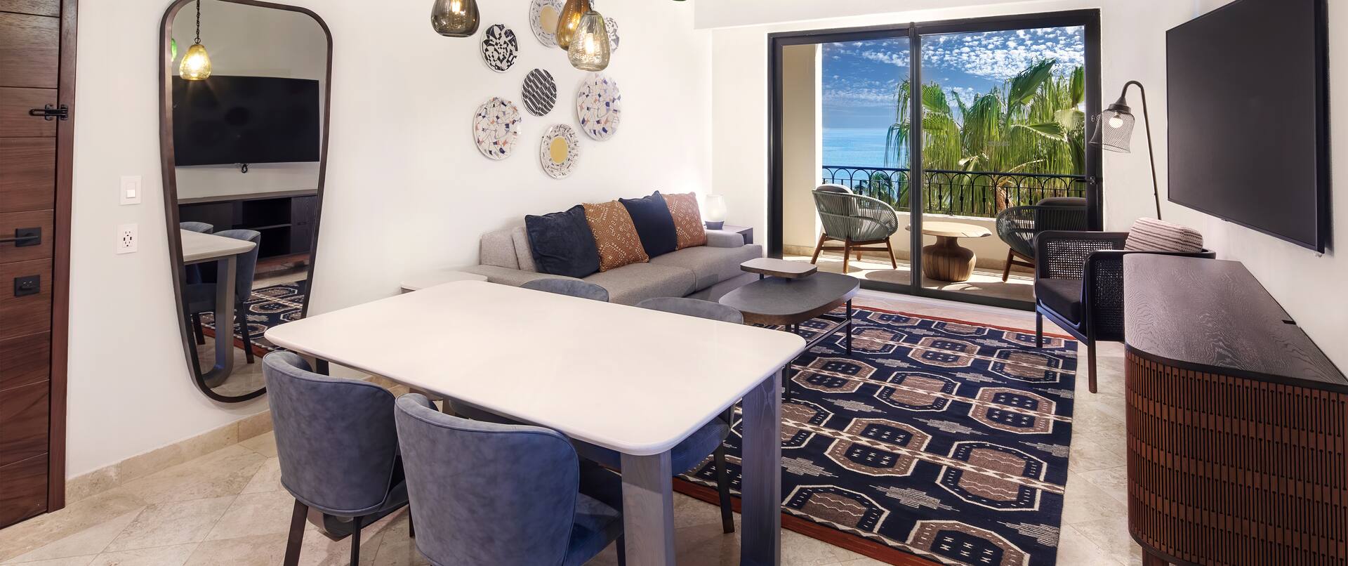 Living Area with Table and Chairs HDTV and Balcony with Ocean View