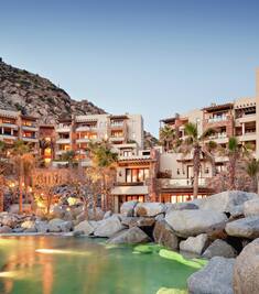 Exterior shot of Waldorf Astoria Los Cabos Pedregal with pool in foreground.