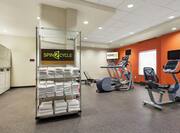 Fitness center with cardio machines and towels
