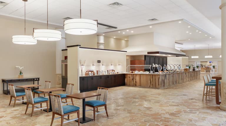 Spacious breakfast area featuring complimentary buffet and ample seating.