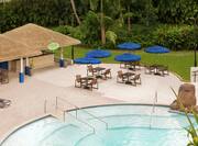 El Coqui outdoor pool bar featuring spacious patio and pool. 