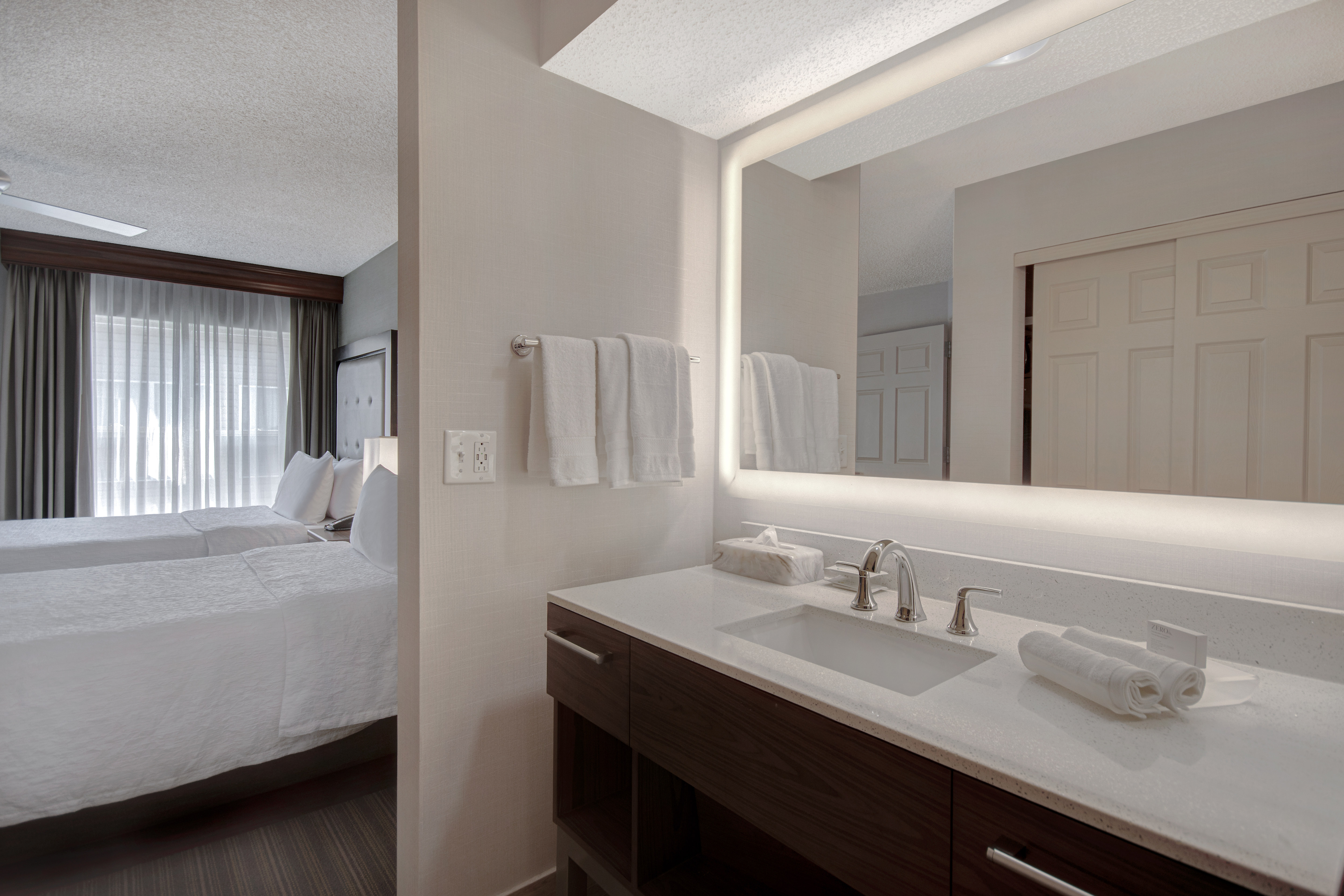 guest bathroom and two beds