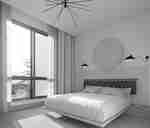 ห้องพักพร้อมเตียงและโคมไฟ