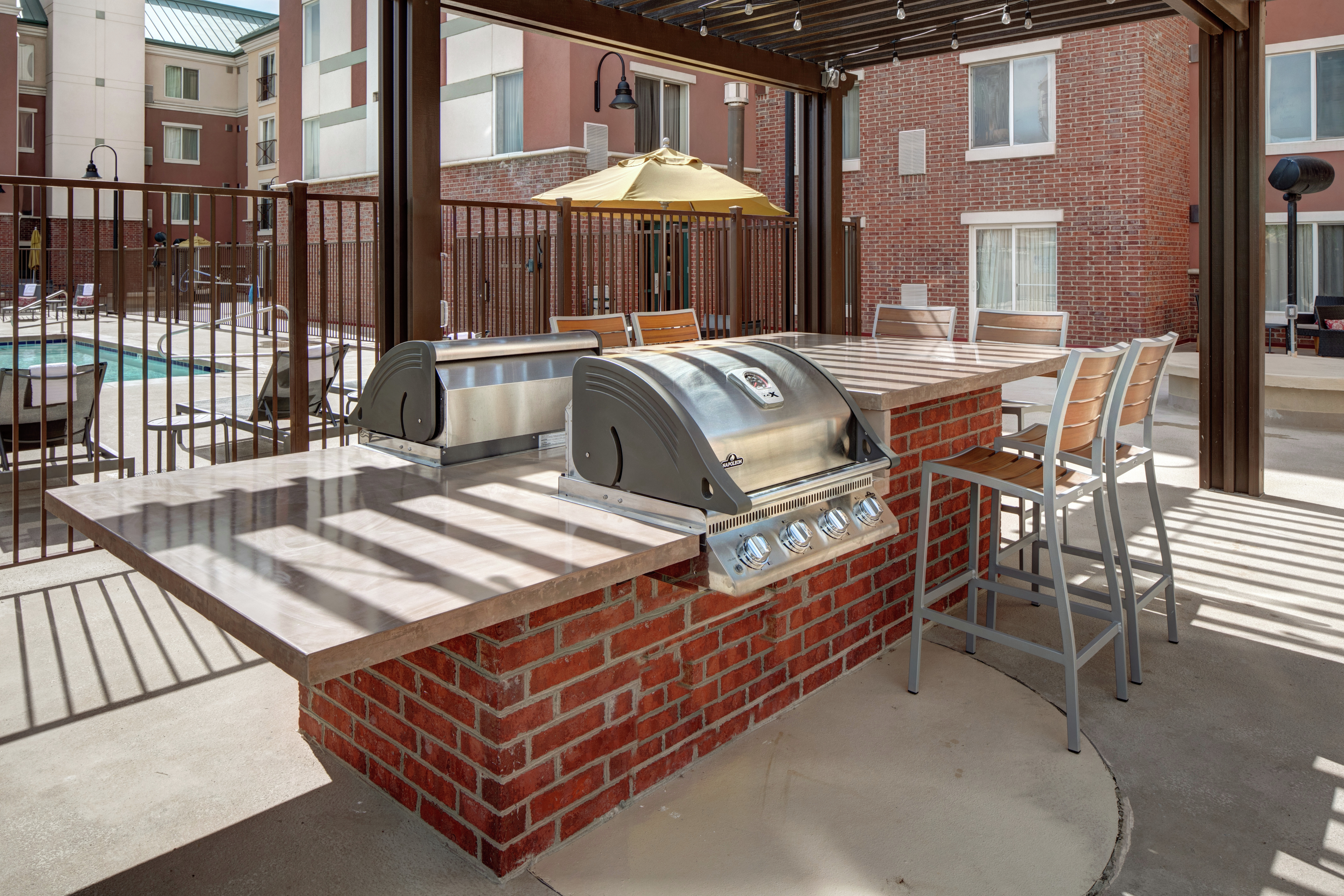 Outdoor Patio Adjacent to the Swimming Pool with BBQ Grill