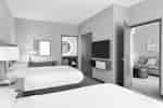 2 Queen Bed Suite with TV and Living Area
