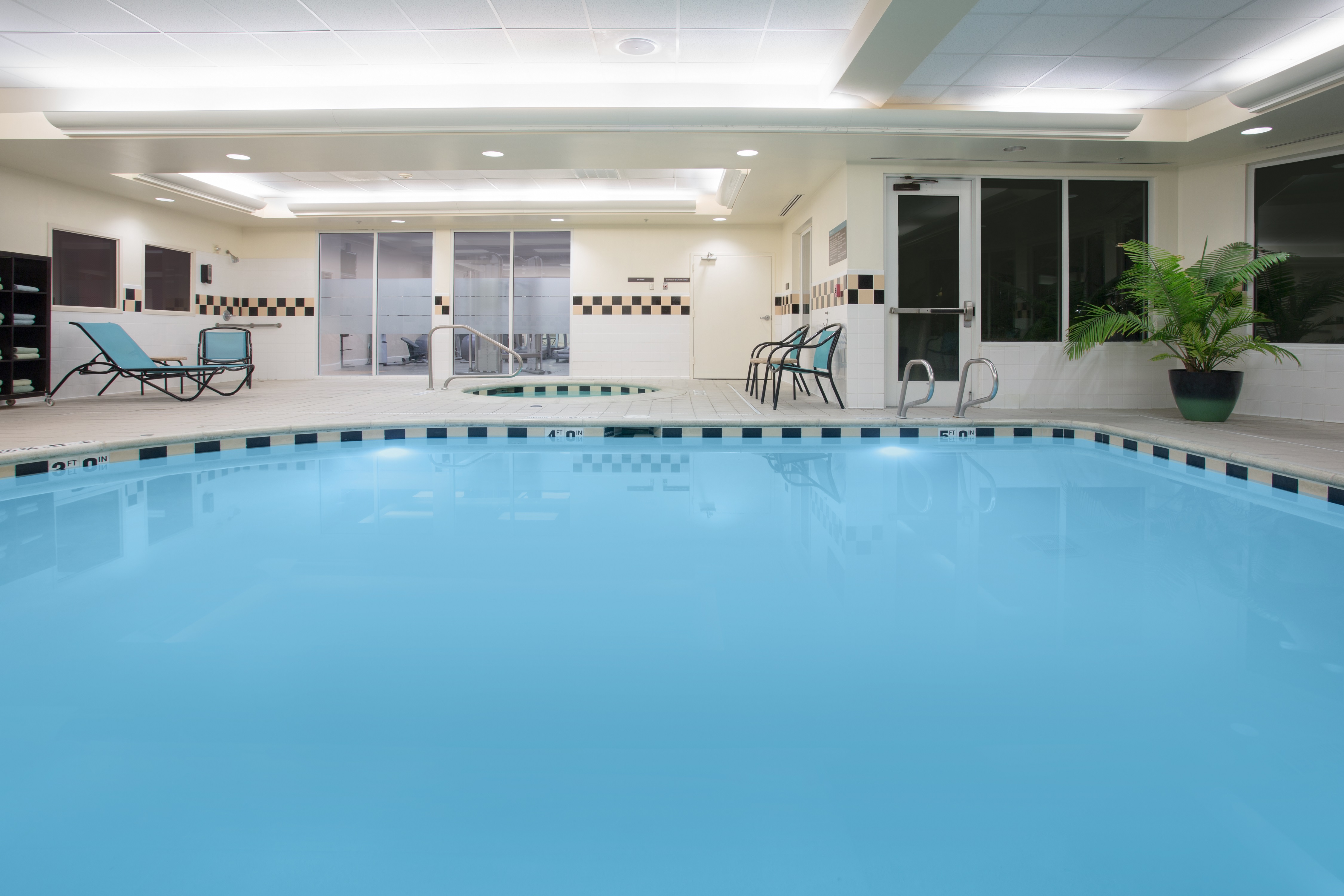 Indoor Pool with Chairs along Side