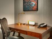 Desk with Lamp Chair and Phone in Hotel Suite