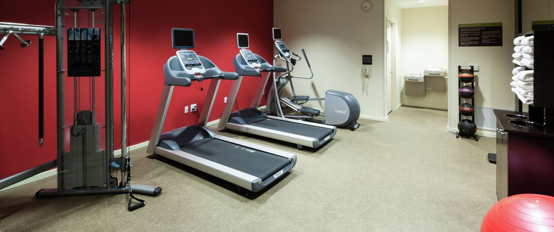 24-Hour Fitness Room with Weights and Cardio Equipment