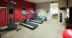 24-Hour Fitness Room with Weights and Cardio Equipment