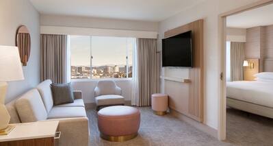 Suite Living Area with City View and Partial View of Separate Bedroom