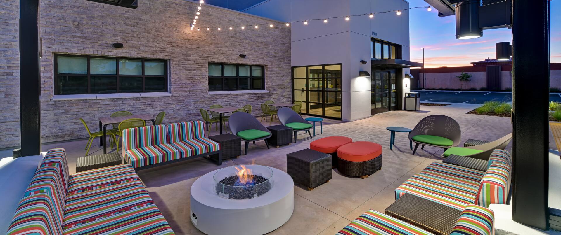 outdoor patio with firepit at dusk