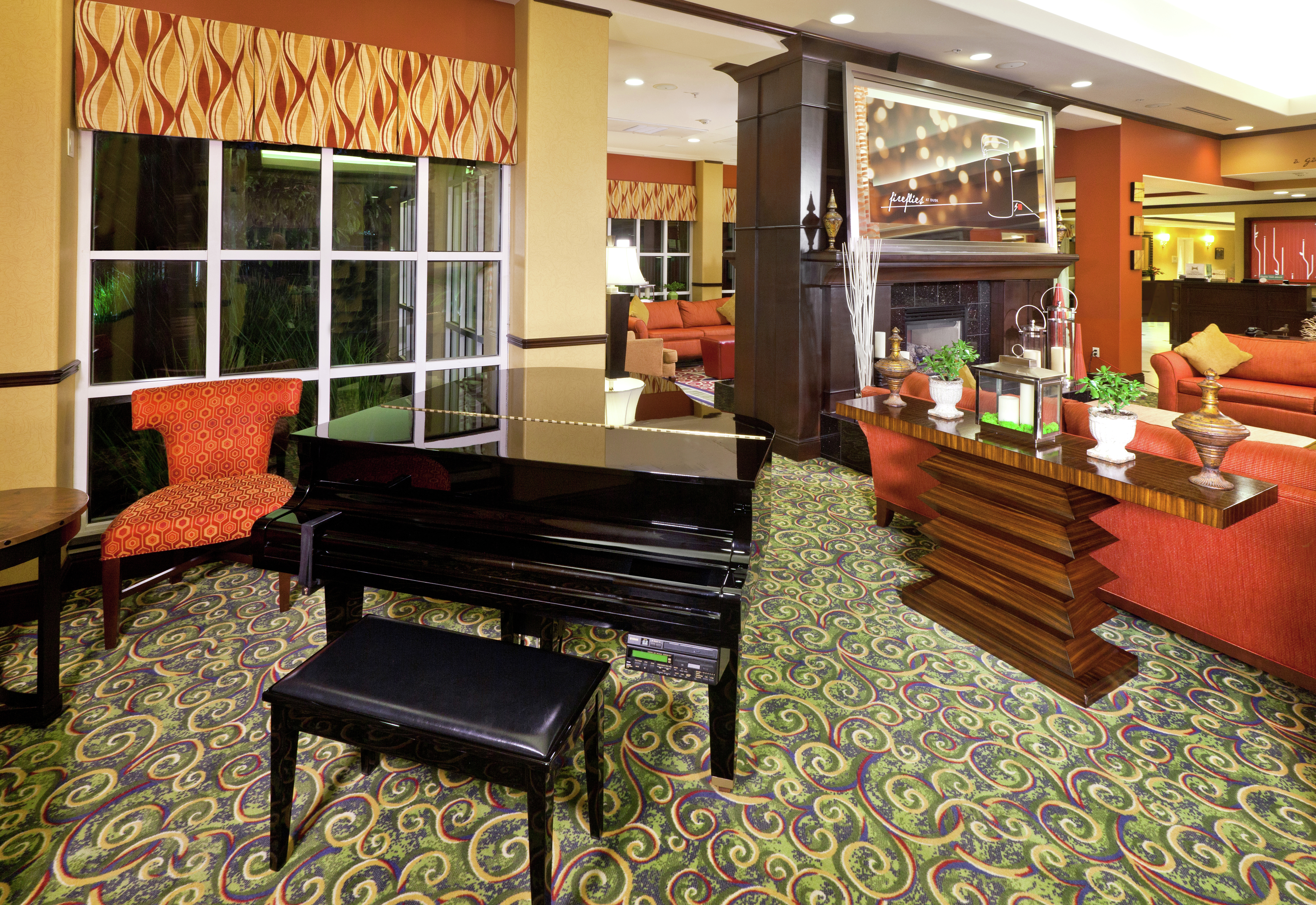 Lobby and Lounge Area with Grand Piano and Modern Furnishings 