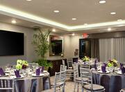 Meeting and Event Space with Banquet Style Seating and Elegant Place Settings 