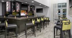 Hotel Bar with Bar Seating and Pub Tables
