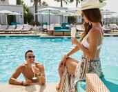 Couple in pool with drink