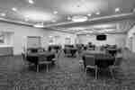 Hotel banquet room with round tables and chairs
