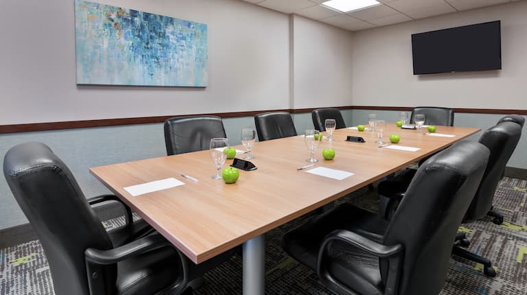Boardroom with Meeting Table, Leather Office Chairs and Wall Mounted TV