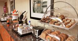 Continental Breakfast Display With Waffles Toast And Bagels