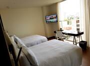 Standard Room with 2 Full sized Beds Desk HDTV and Large Windows