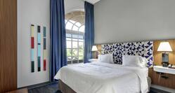 Single King Bedroom in Whirlpool Guestroom Suite 